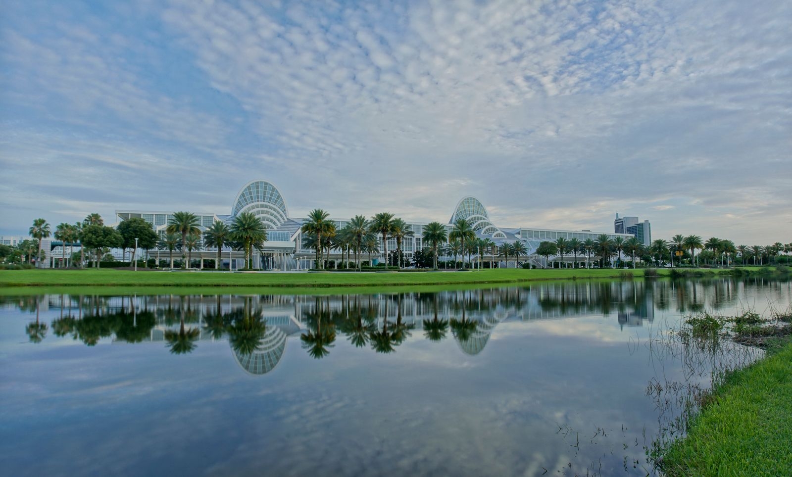 Orange County Convention Center building and reflection in lake