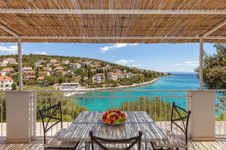 Vacation rentals on the Dalmatian Coast with sea views Villa Duje covered balcony area with sea view