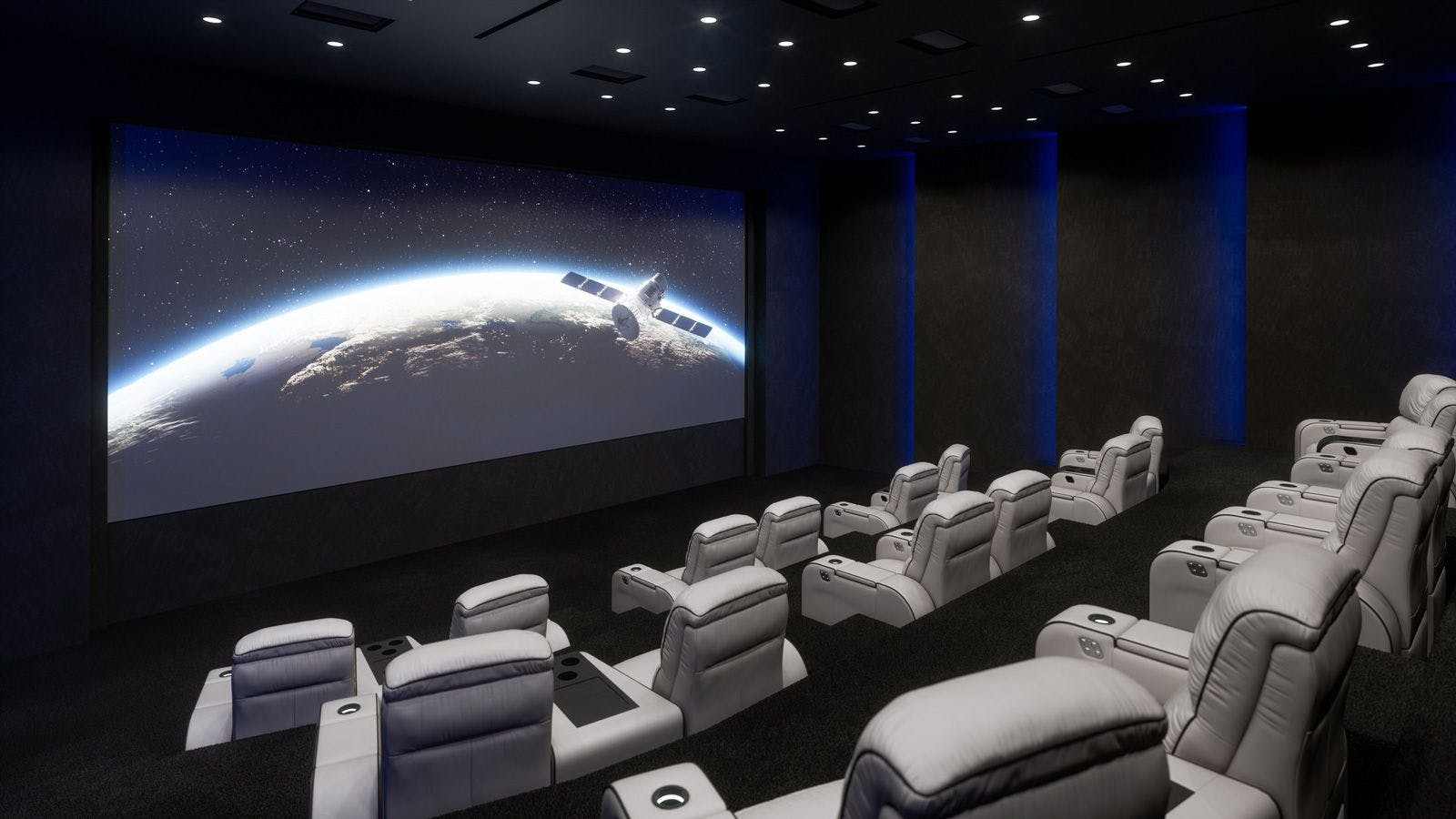Luxury private movie theater with grey leather chairs and large screen