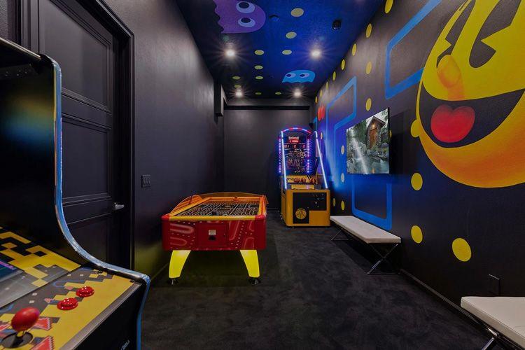 Villatel Village 8 game room with arcade machines and foosball