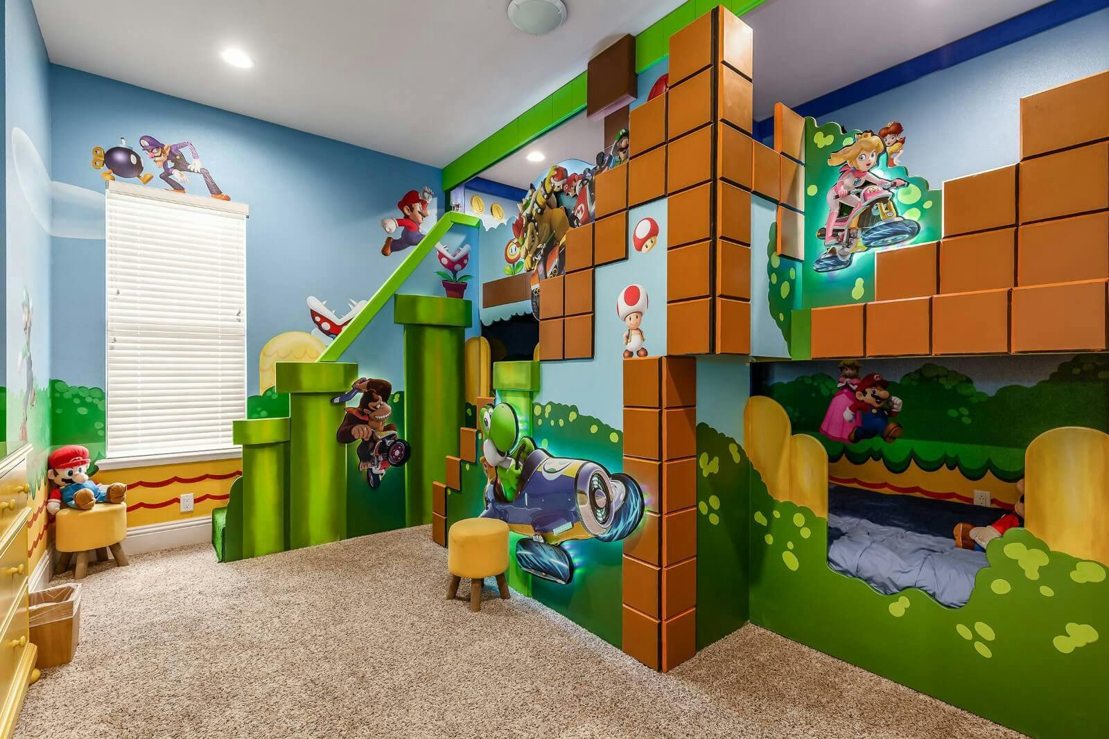 Super Mario themed bedroom with bunkbeds, slides and decorated walls