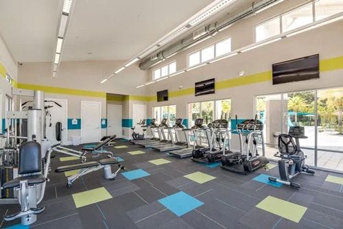 A gym with exercise equipment