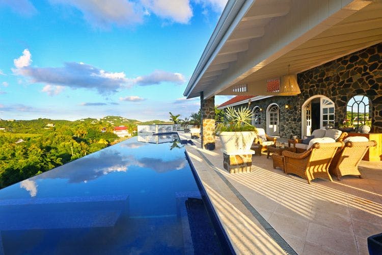 Cap Estate villas with private pools - Villa Atlantis with infinity pool overlooking looking trees