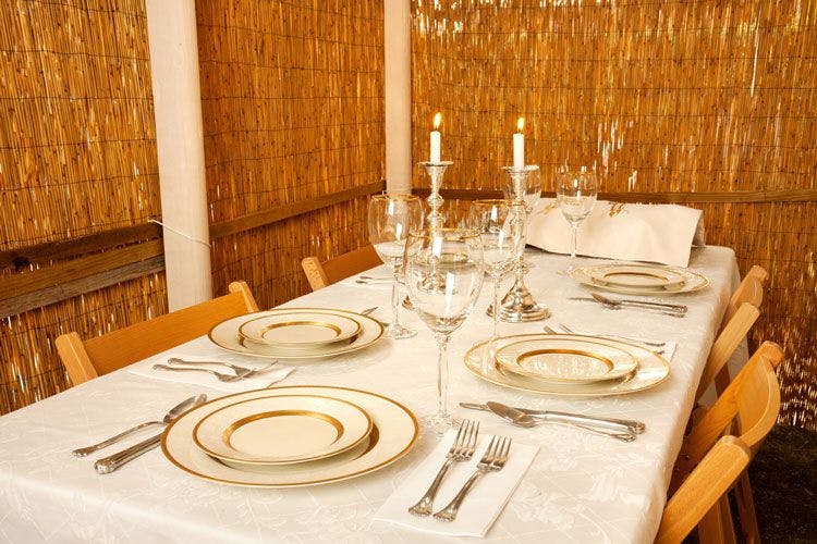 Sukkot shelter with table laid for dinner