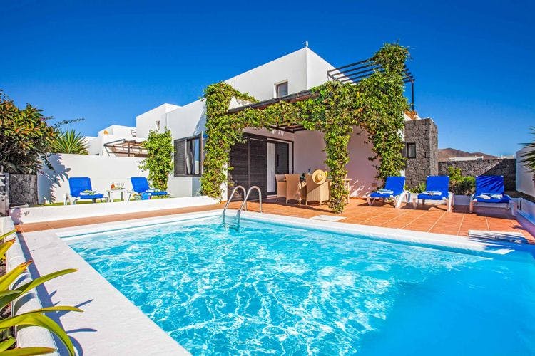 Villas for the best family holidays in Lanzarote - Villa Cisne traditional Spanish villa with vines growing on the wall and a private pool