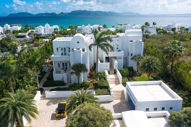 Shiloh Estate villa in Anguilla - large white-painted multistory home near the sea