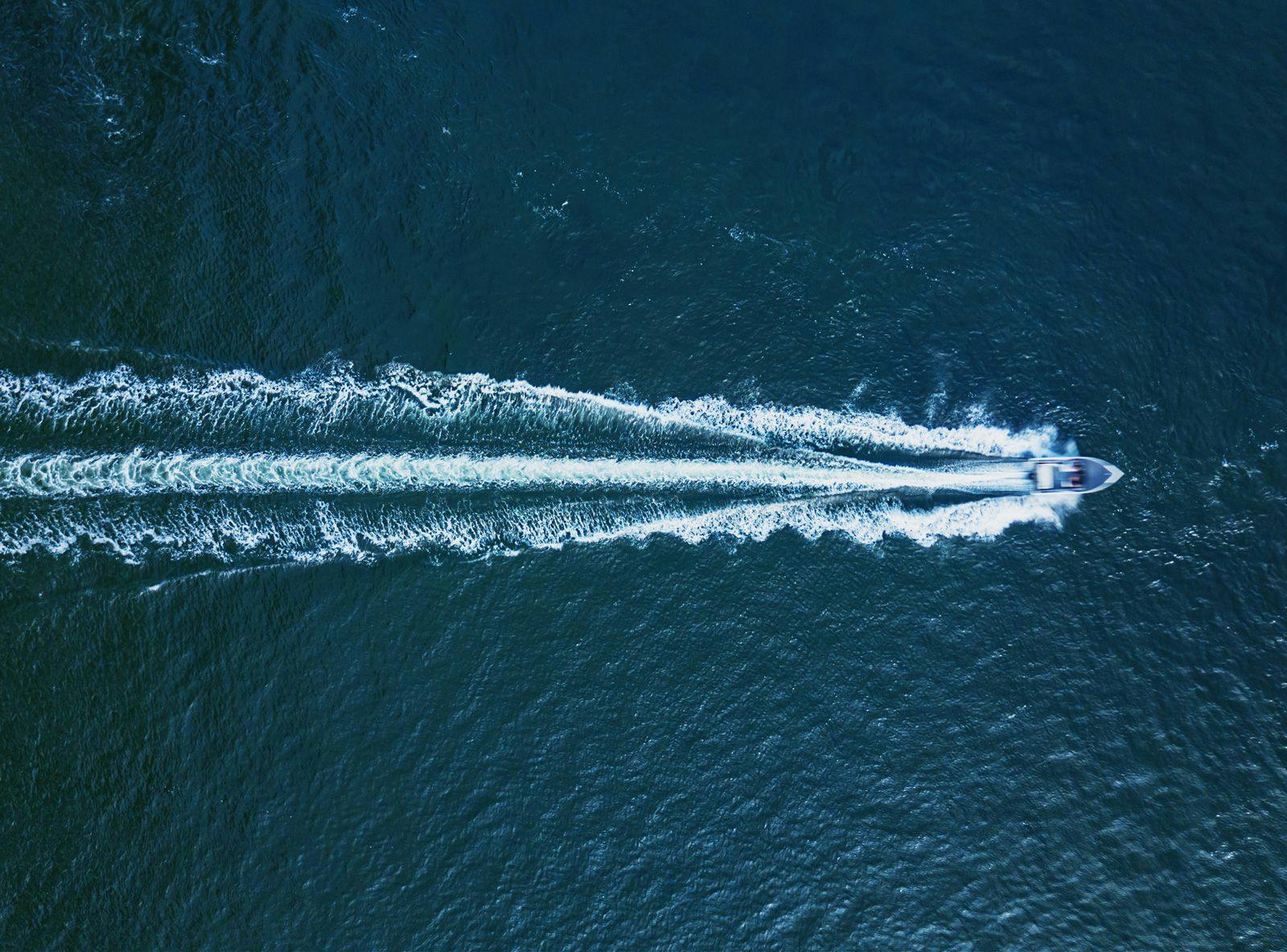 Ariel shot of a speedboat moving through the sea