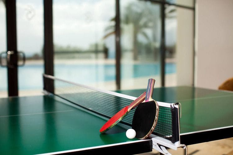 Ping pong table with paddles and ball