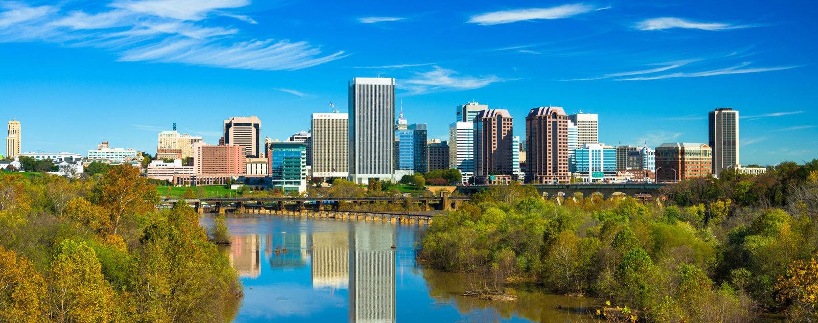 The skyline of Richmond city in Virginia reflected in a lake