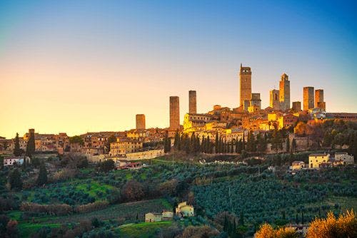 The towers of San Gimignano on top of a Tuscan hill