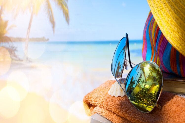 Sunglasses on a Caribbean beach in the sunshine
