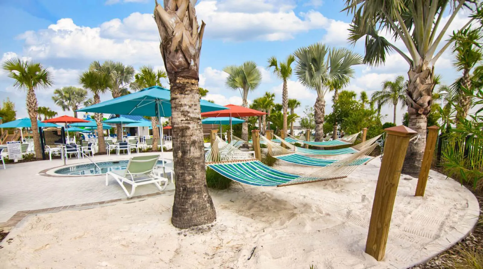 Windsor Island Resort shared pool area with hammocks, parasols, and hot tub