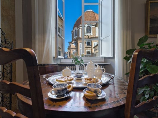 Ippolita Tuscany villa in the center of Florence city, with a view of a historic building out of the window