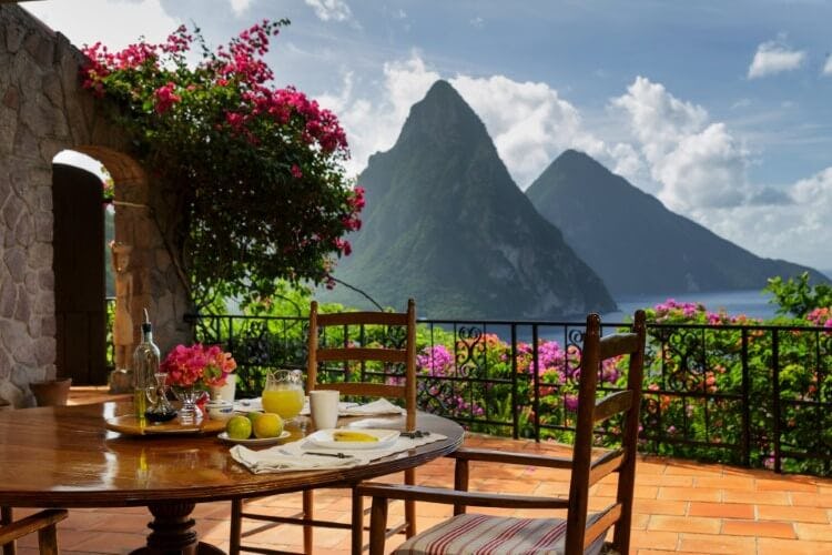 table with iconic st lucia mountains in background