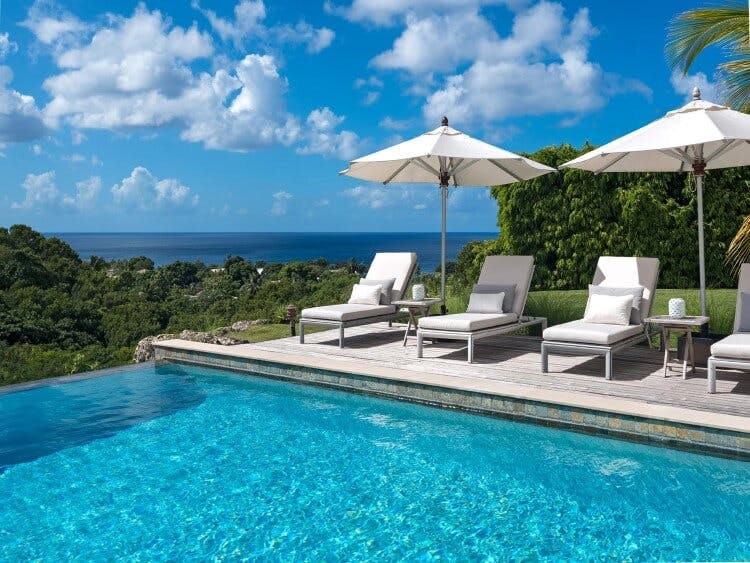 Atelier House vacation rental private pool with sun loungers and umbrellas