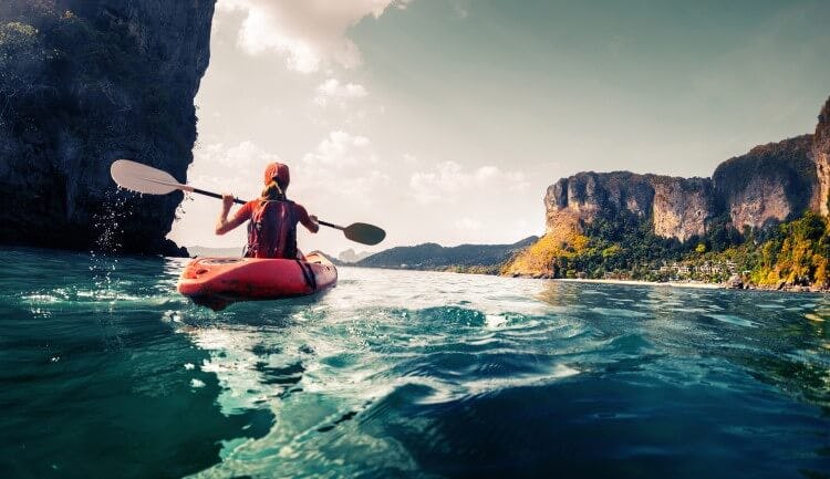 A woman kayaking in Thaliand