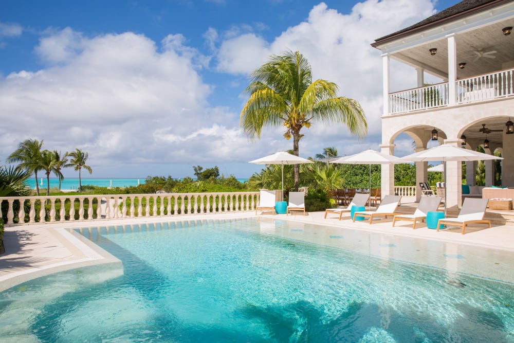 Amazing Grace Turks and Caicos villa rental with private pool and sun loungers overlooking the Caribbean Sea