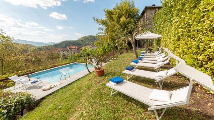 tuscan garden with pool and loungers