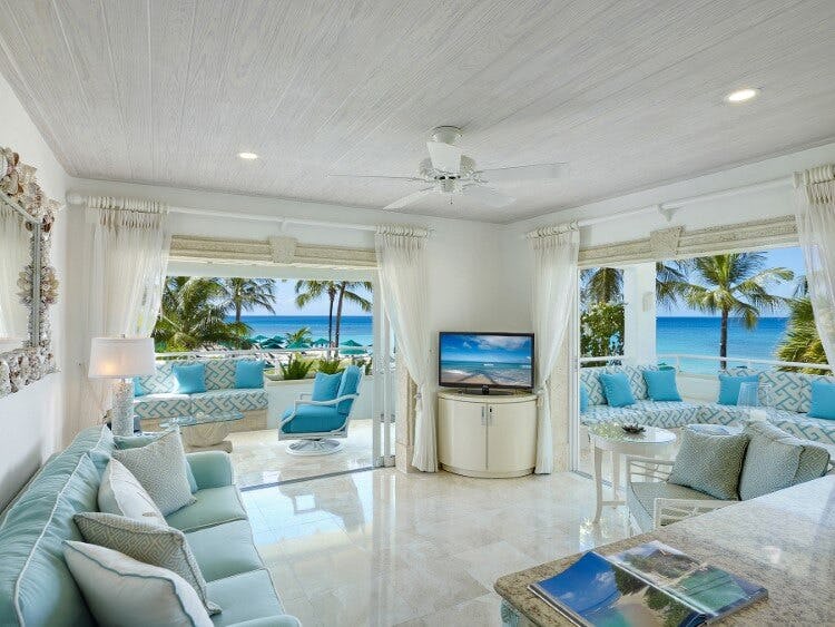 living room with sea beyond open doors