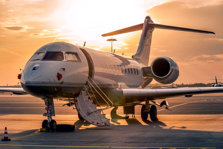 Private Jet Charter sunset runway view Top Villas