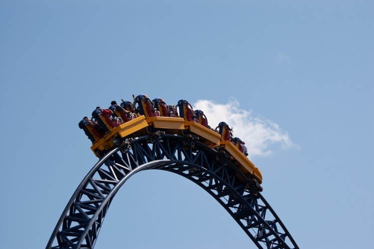 A roller coaster car going over a crest