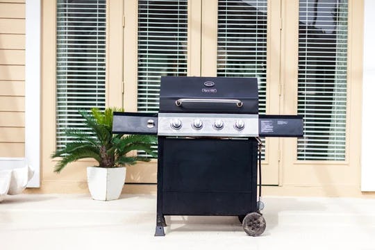 A black and silver barbeque unit outside a vacation rental