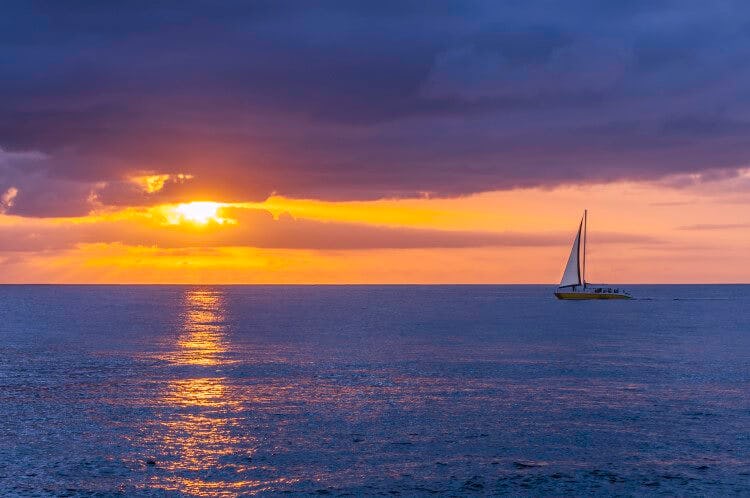 A sailboat at sunset