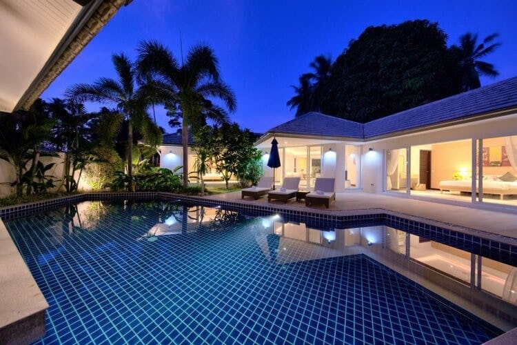 pool in front of a white villa
