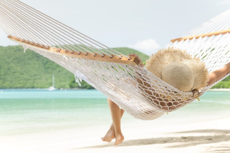woman on beach hammock