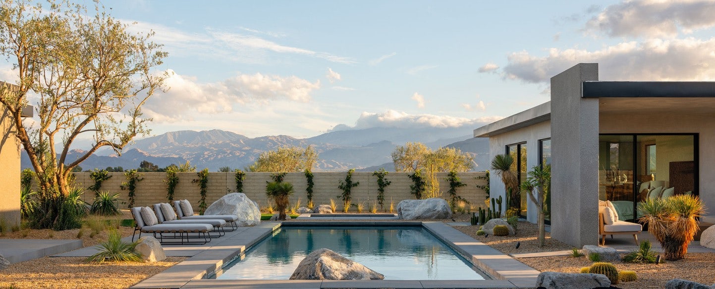A luxury vacation rental with private pool and mountains in the background