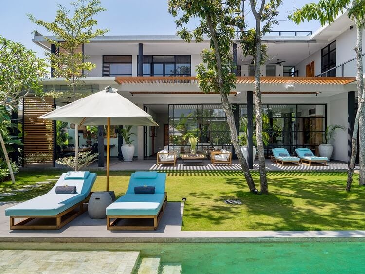 modern villa with sun loungers