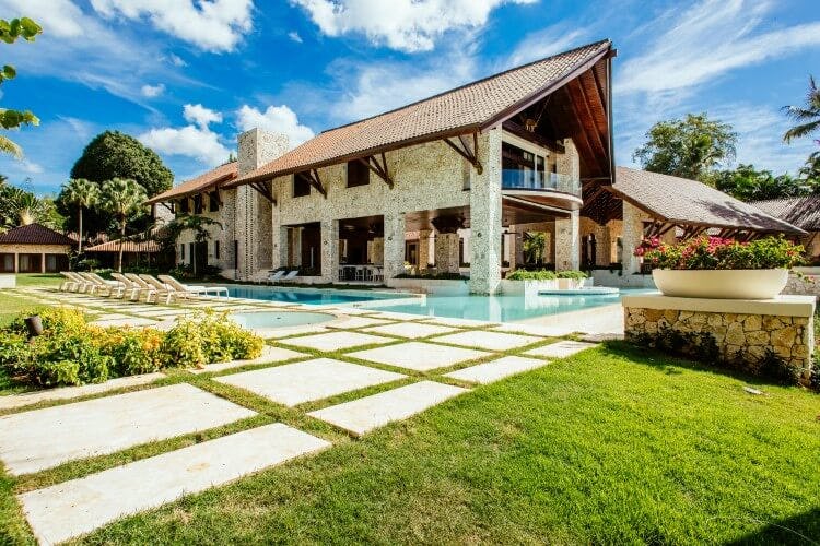 rustic stone villa with pool and lawn