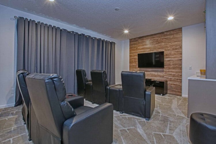 movie theater room with black seats