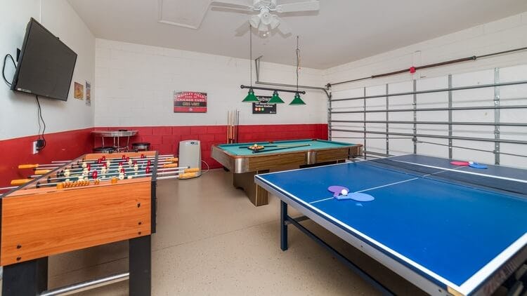 games room with foosball and tennis table