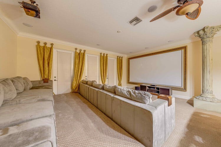gold toned cinema room with grey seats
