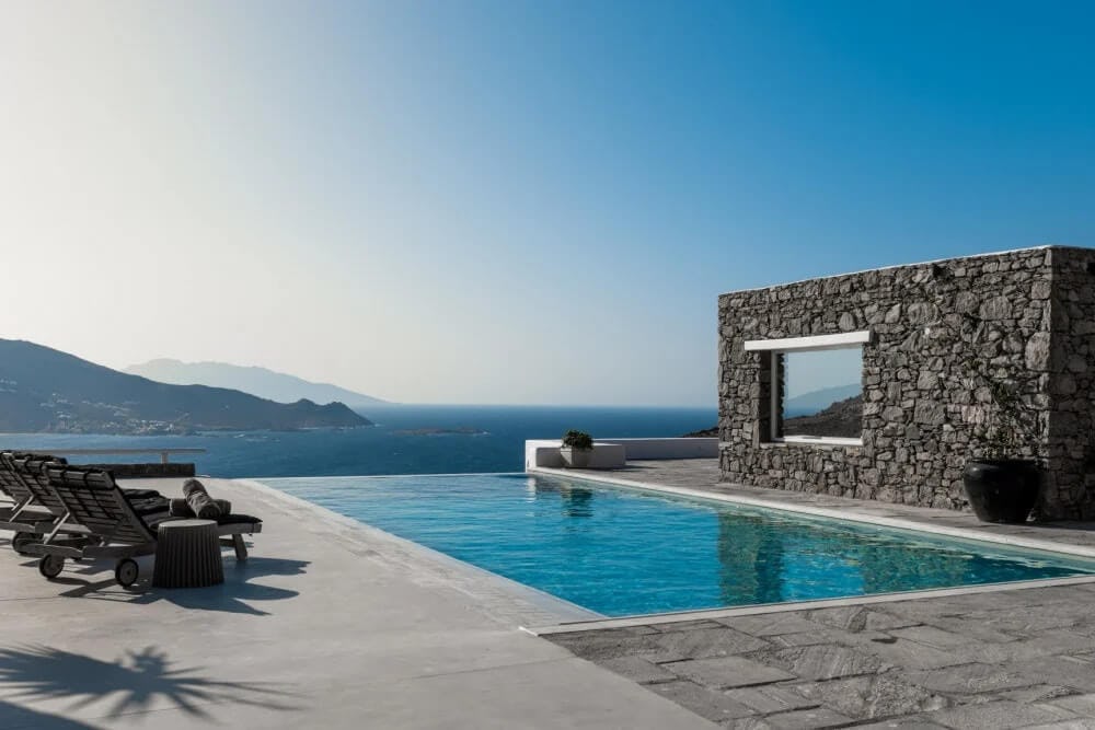 stone villa with pool overlooking ocean