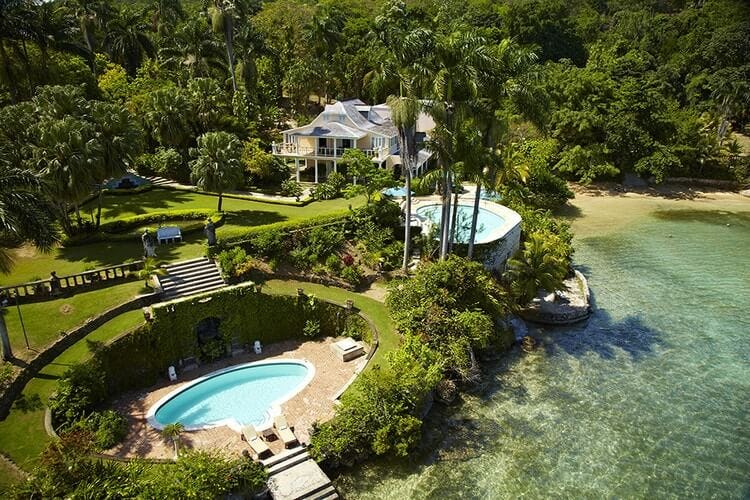 aerial view of vacation rental next to water