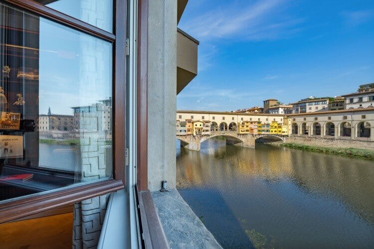 view through a window of river in florence
