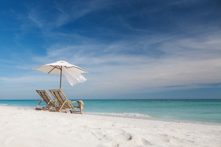 Beach chairs and an umbrella on a Florida beach