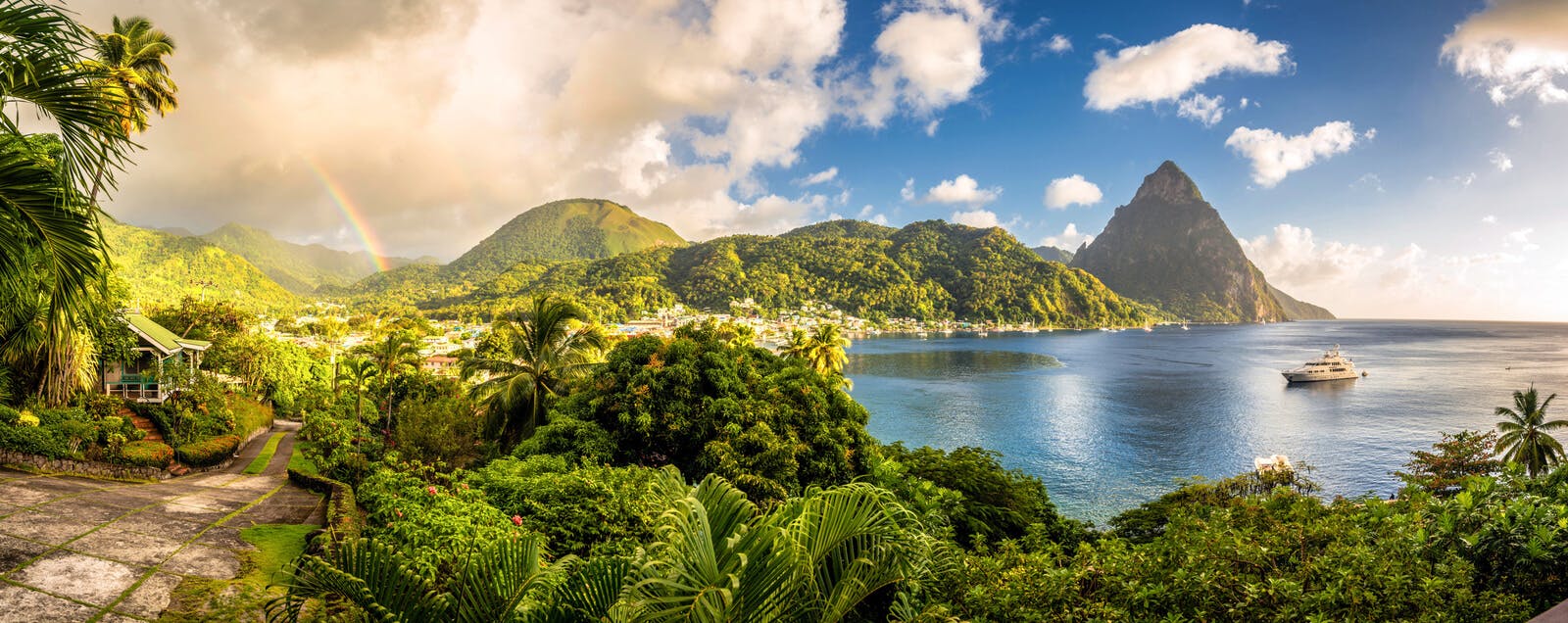 A panoramic view of the Pitons and a beach bay in Saint Lucia