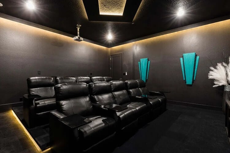 dark movie theater with black seats
