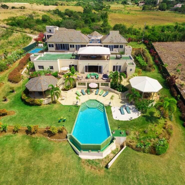 aerial view of large home with pool