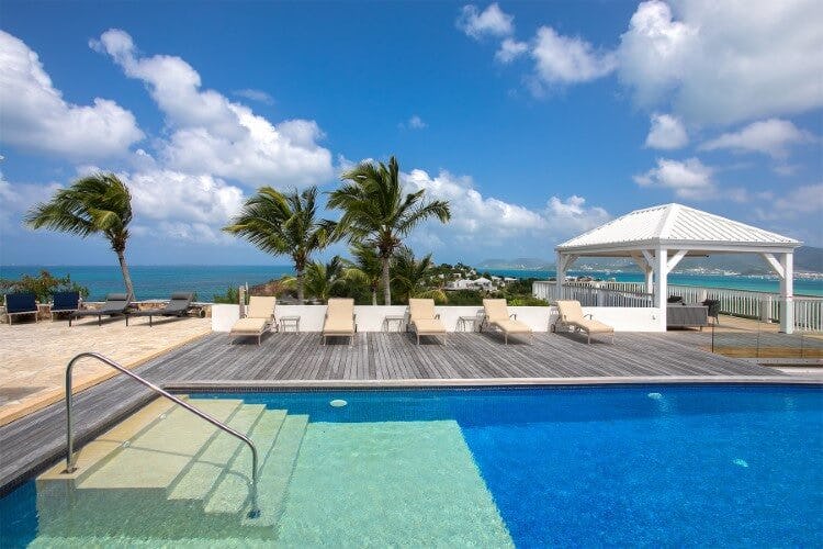 pool on deck with ocean in background