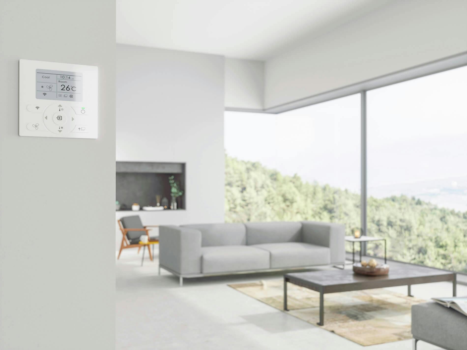 Villas with air conditioning. A temperature control display in front of a grey living room