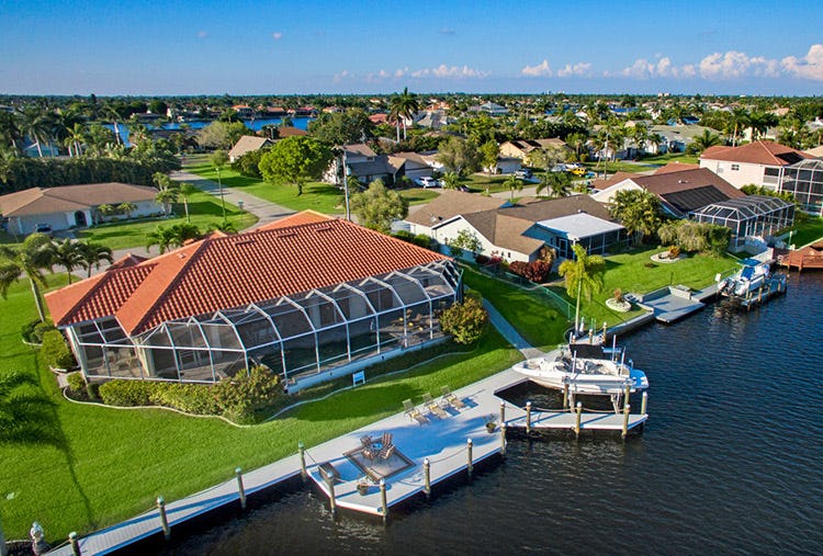 Cape Coral 239 vacation rental with large covered pool, dock, and boat