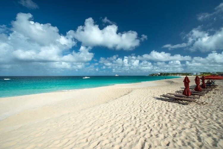 Anguilla beach with white sand and a line of sun loungers