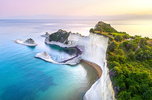 Cape Drastis - a limestone headland covered in green forest