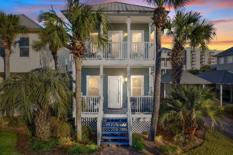 tall blue vacation rental at sunset