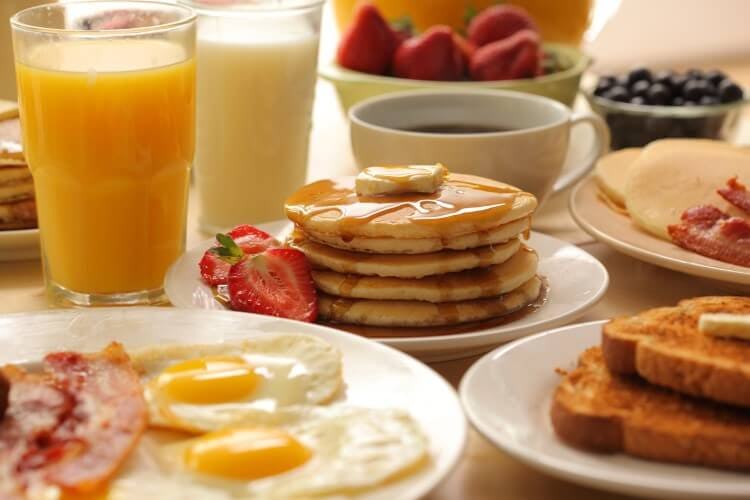 An assortment of breakfast food and juices