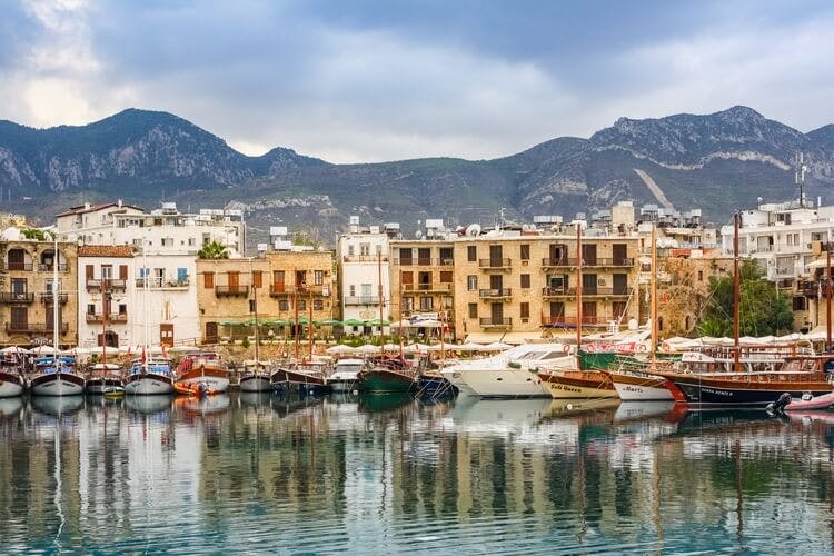 A bay in Cyprus with boats and mountains